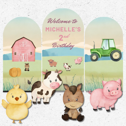 Farm-themed birthday backdrop with barn, tractor, and cute animal cutouts for a barnyard party.