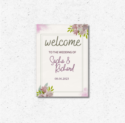 Romantic floral wedding welcome sign with personalized names and date displayed at a wedding entrance.