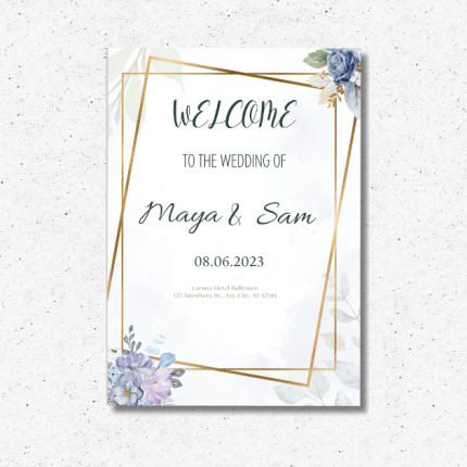 Personalized wedding welcome sign with floral accents and gold geometric frame on an easel.
