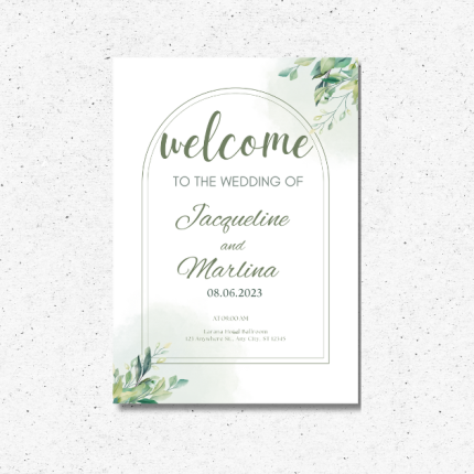 Elegant greenery wedding welcome sign on easel with personalized names and date.