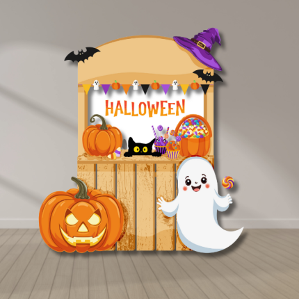 Halloween candy stand backdrop with ghost cutout, pumpkins, jack-o’-lantern, bats, and candy bucket — UV-printed event decoration for Halloween parties.