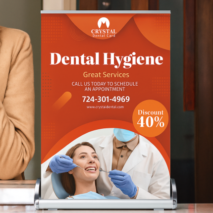 Custom retractable banner stand displaying professional real estate advertising indoors