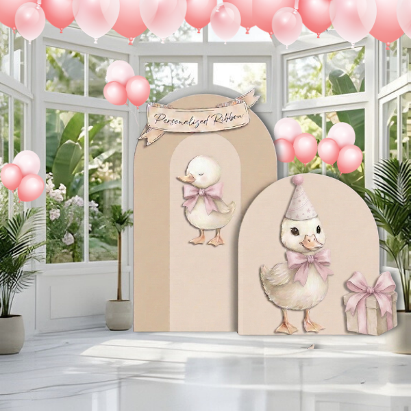 duck first birthday backdrop party setup with balloons and decorations