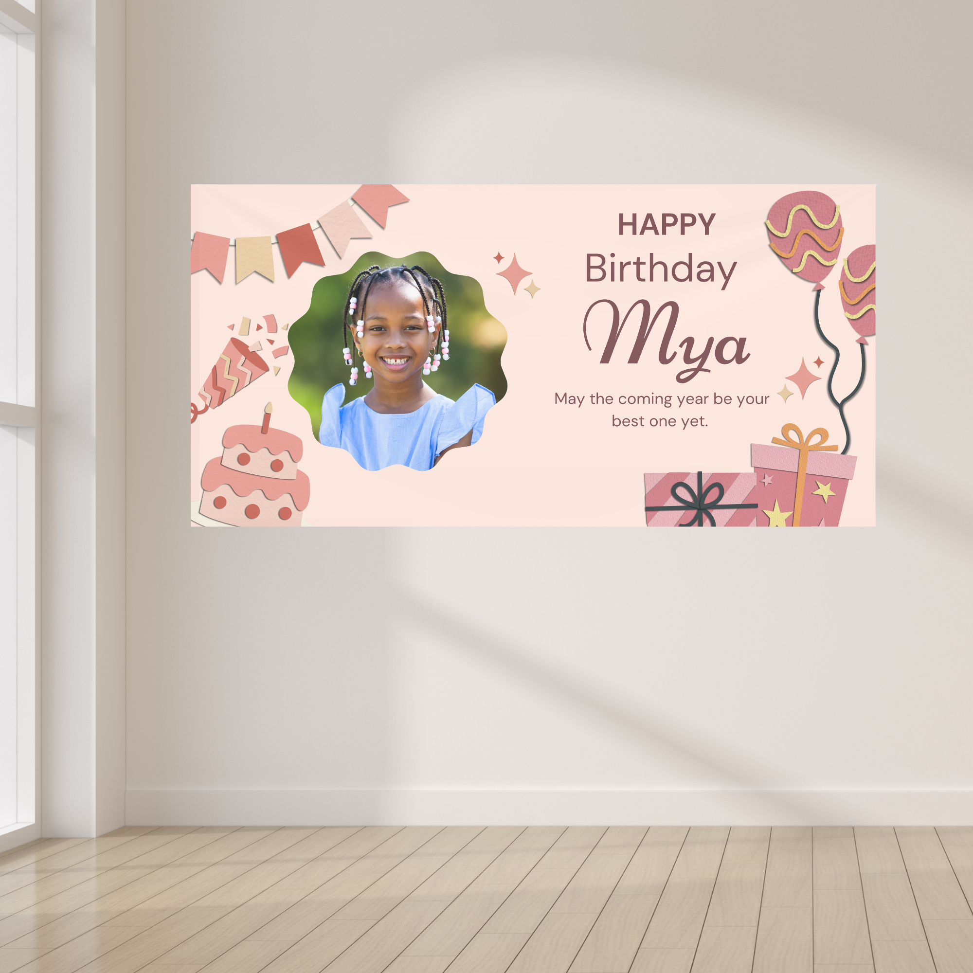 Personalized pink kids birthday banner displayed with a neutral balloon garland and decorative party backdrop