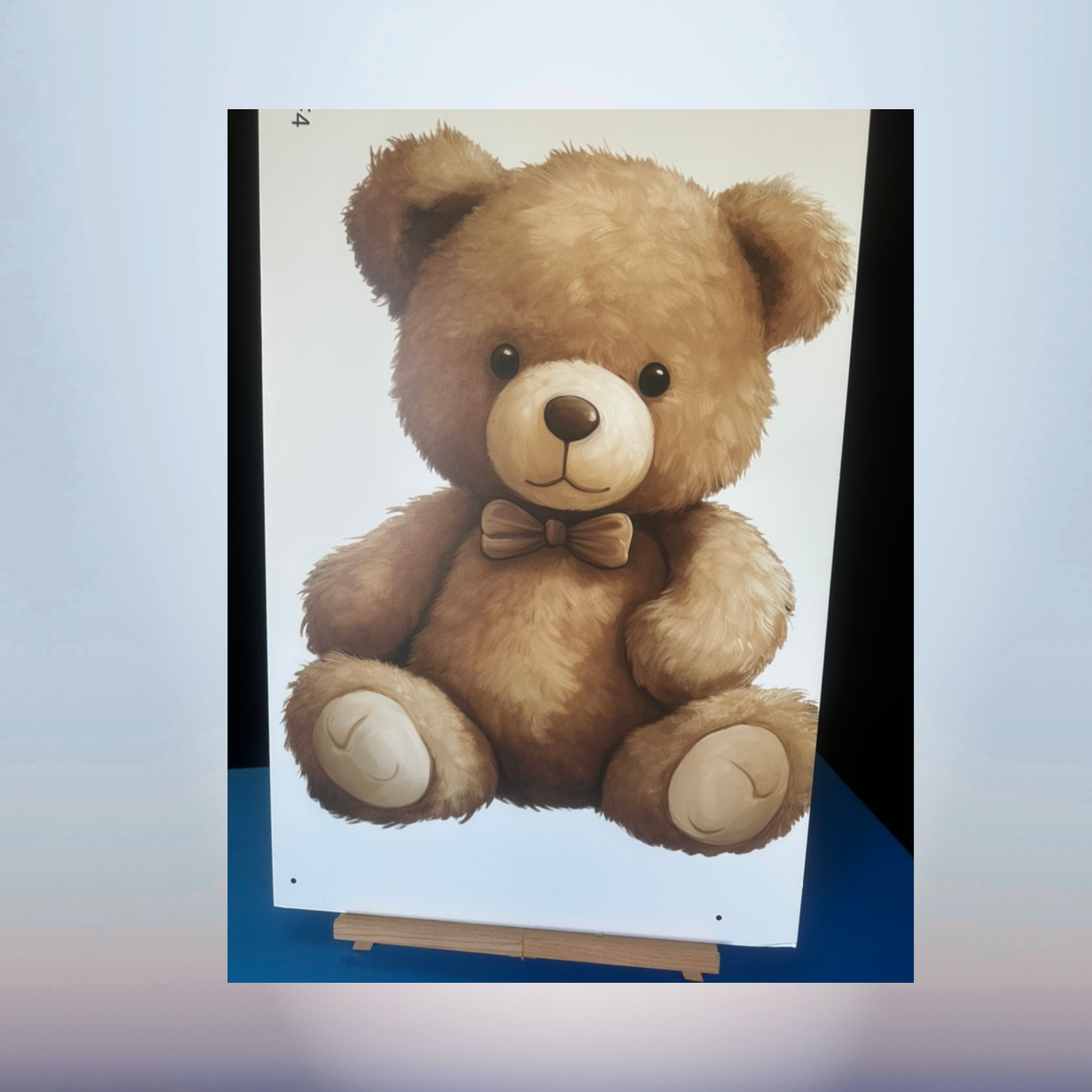 Brown sitting teddy bear character cutout for a baby shower display
