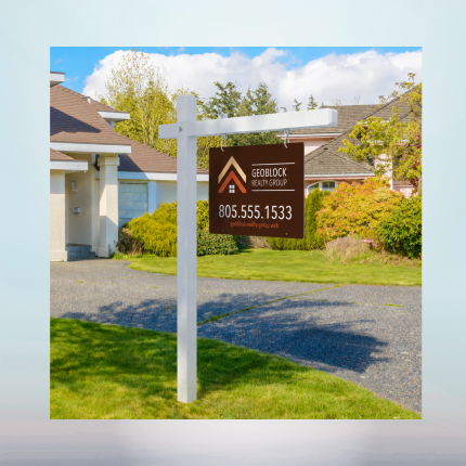 Custom ACM real estate sign mounted on a white post in front of a residential property