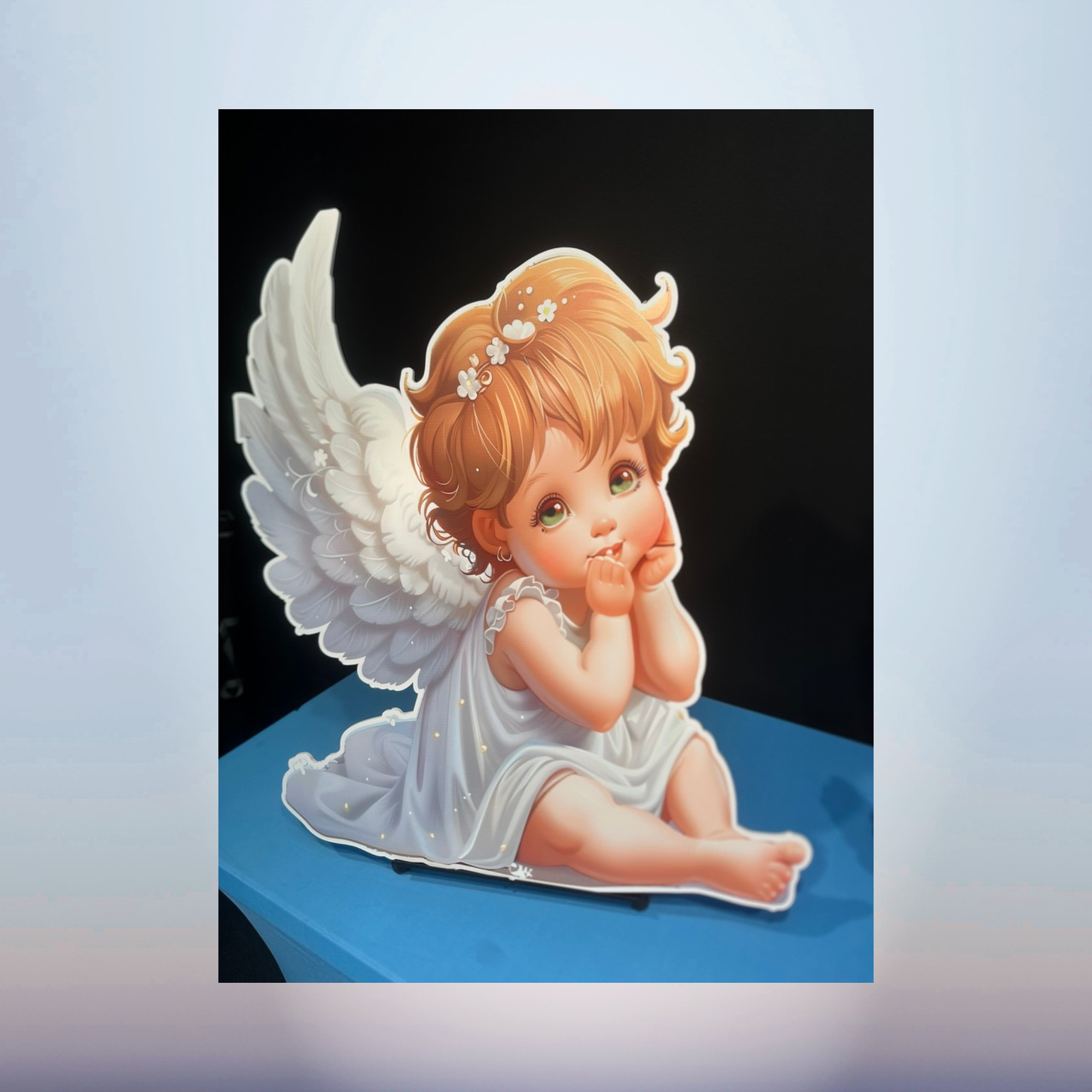 Seated baby cherub angel character cutout with red hair for baby shower décor