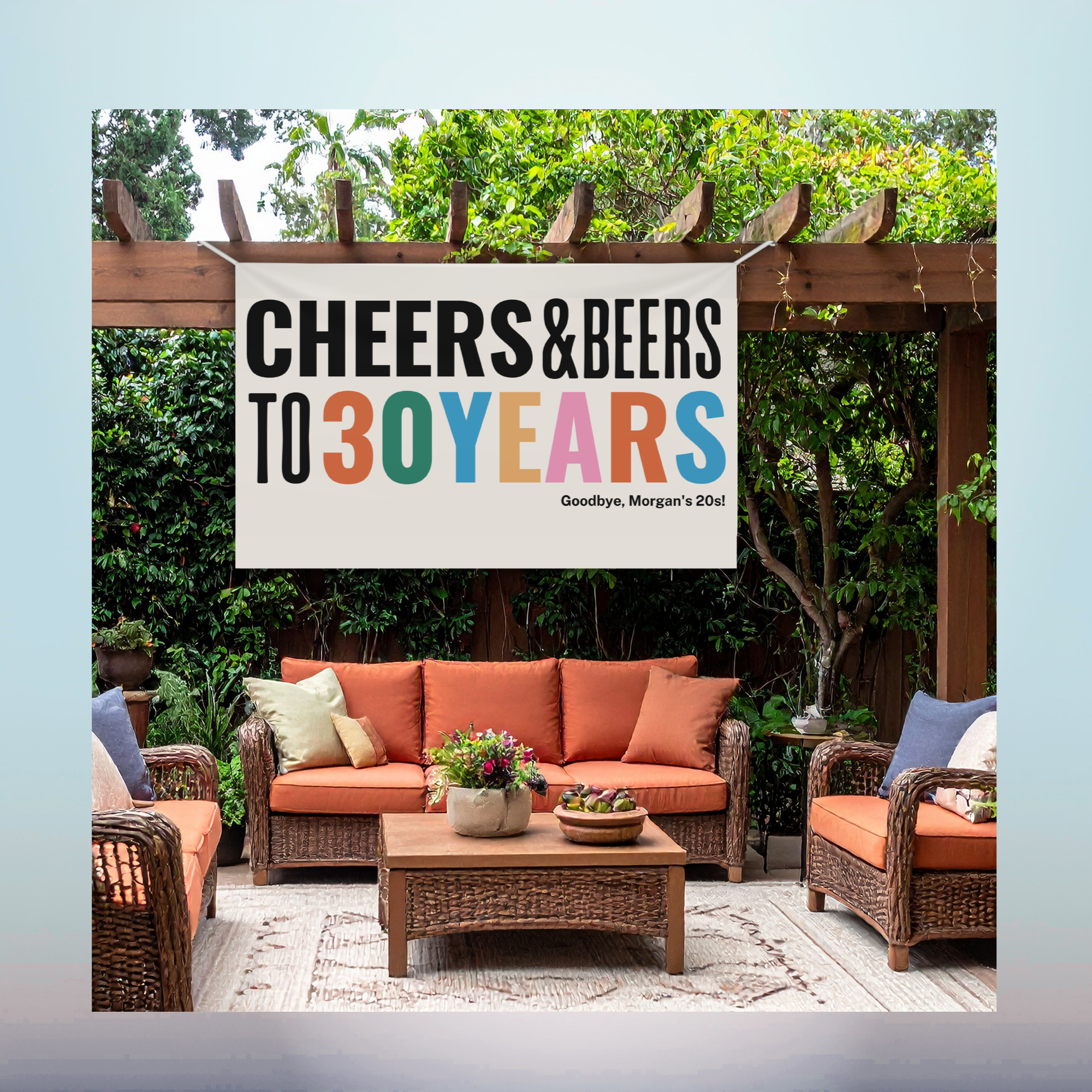 Custom Vinyl Banner Printing Custom retirement vinyl banner hanging outdoors over a backyard seating area.