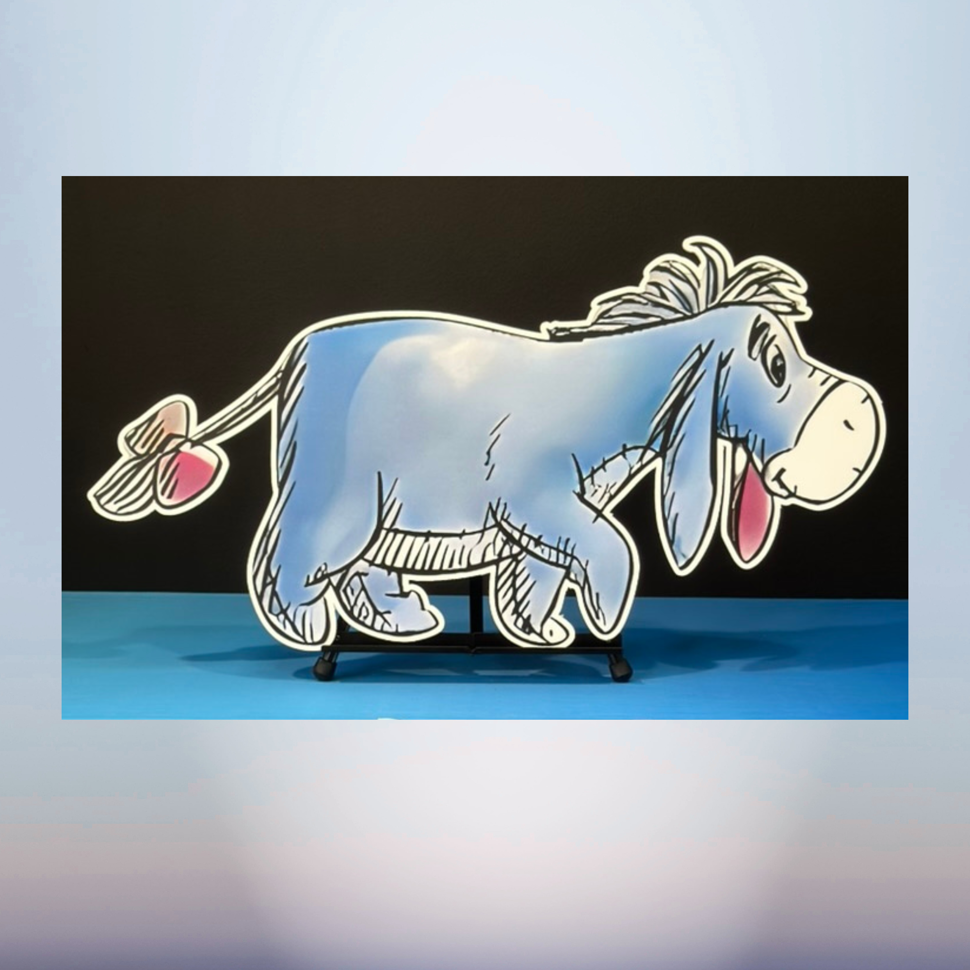 Eeyore character cutout for a Winnie the Pooh themed baby shower