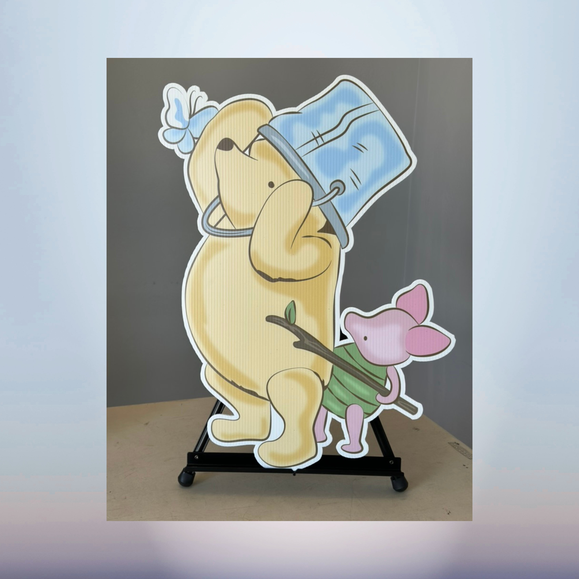 Winnie the Pooh and Piglet honey character cutout for baby shower décor