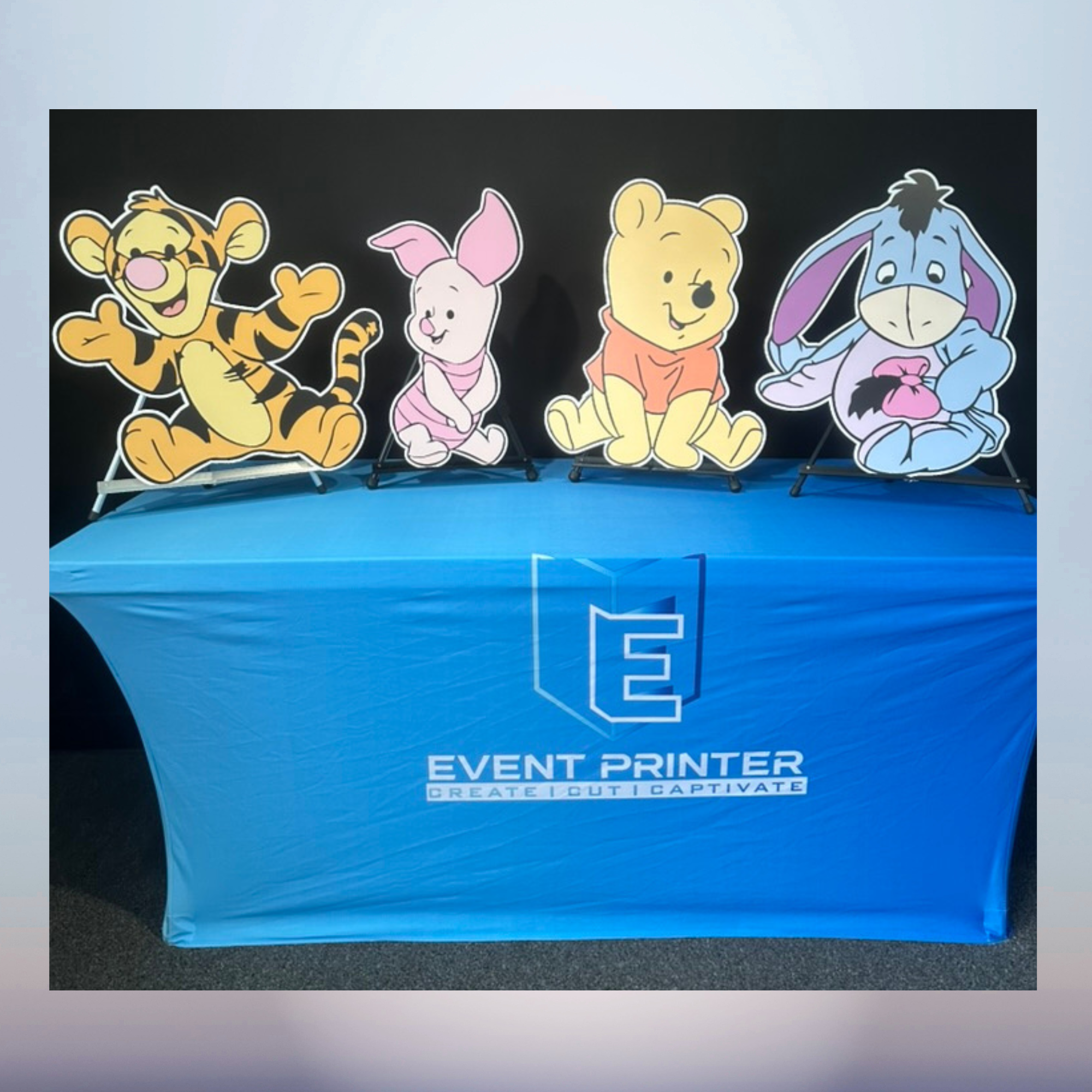 Winnie the Pooh Piglet Tigger and Eeyore character cutouts for a baby shower
